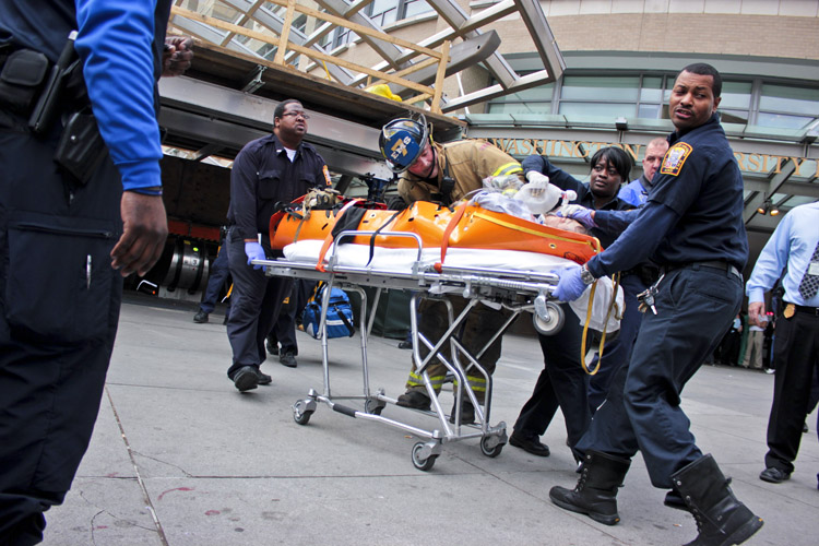 Medics emerge from the Foggy Bottom Metro station with an unidentified male who was struck by a train after he appeared to intentionally step on to the tracks. He was pronounced dead upon arrival at GW Hospital, Washington Metropolitan Area Transit Authority spokesman Dan Stessel said.