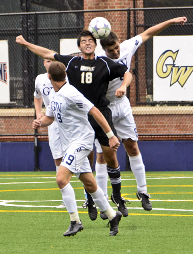 Matthew Scott collides with a Bryant opponent for a header during an intensely physical match that saw GW score the game-winning goal with just 1:36 left in play.