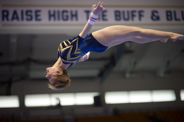 Taylor Redmond goes airborne as she dismounts from the uneven bars. She placed fifth in the event with a score of 9.70.