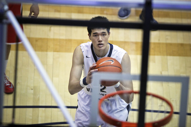 Yuta Watanabe, the first Japan-born student-athlete to secure a NCAA Division I basketball scholarship, heads to the line for a free throw during a game against Davidson.