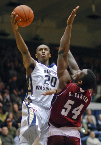 Lasan Kromah pushes past Sean Carter of UMass for a layup.