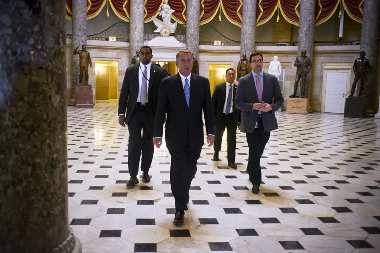 Boehner heads to the House floor before a crucial vote to avoid a shutdown of the Department of Homeland Security. Unexpectedly, an initial vote to extend funding for three weeks failed after 52 Republicans rebelled, refusing to vote for any bill without riders that defunded the President's deferred deportation programs. The GOP leadership scrambled to find an alternative.