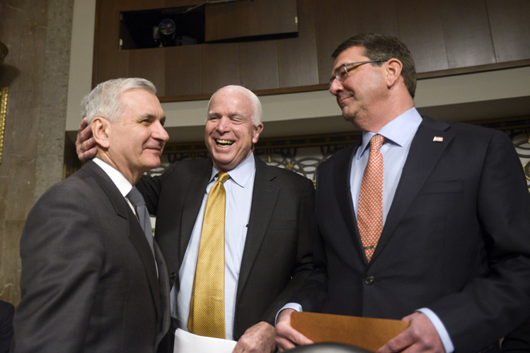 Ashton Carter, President Obama's Defense Secretary nominee, meets with the Senate Armed Forces Ranking Member Jack Reed, left, and Chairman John McCain, center, before his confirmation hearings. The committee's questioning of Carter was a cordial affair that underscored the bipartisan support for Carter. He was later easily confirmed, 93-5.